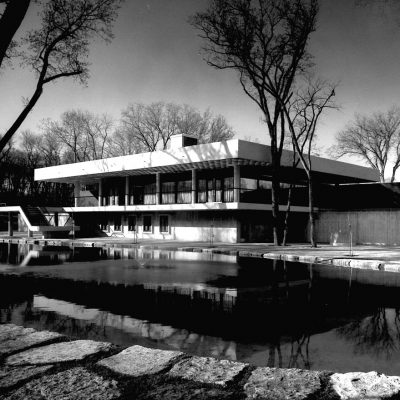 A black and white photograph of the exterior of the Peguis Pavillion at Kildonan Park.
