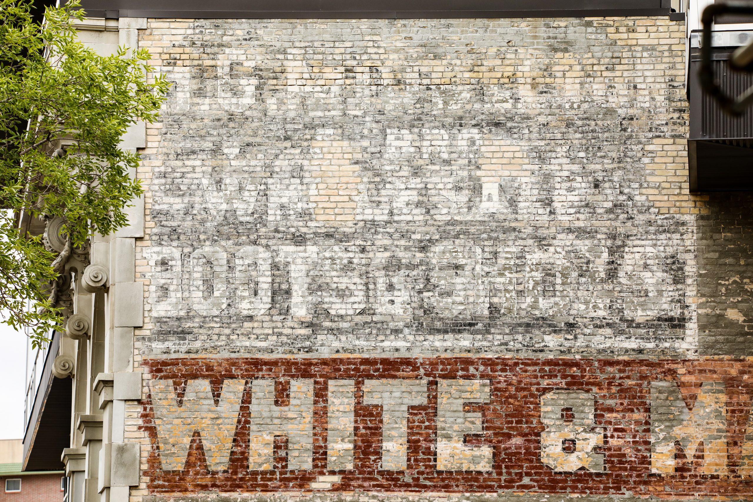 Ghost Sign of White and Mannahan at 500 Main Street.