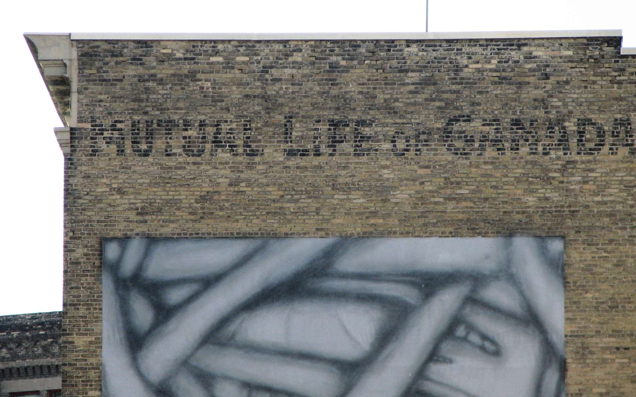 Ghost Sign on former Bate Building at 221 McDermot that reads Mutual Life of Canada