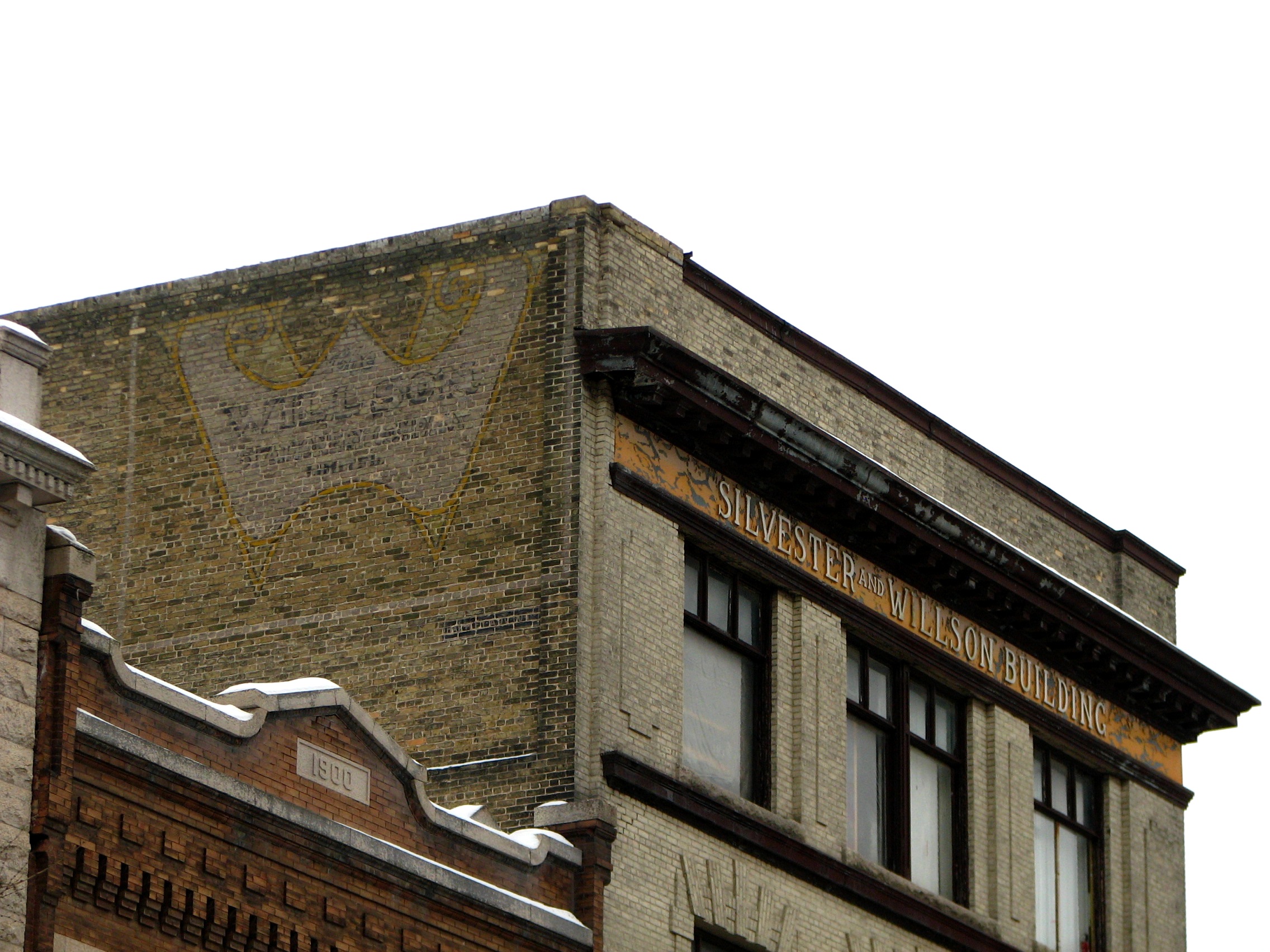Close-up photo of the Wilson Stationary ghost sign at 222 McDermot Avenue