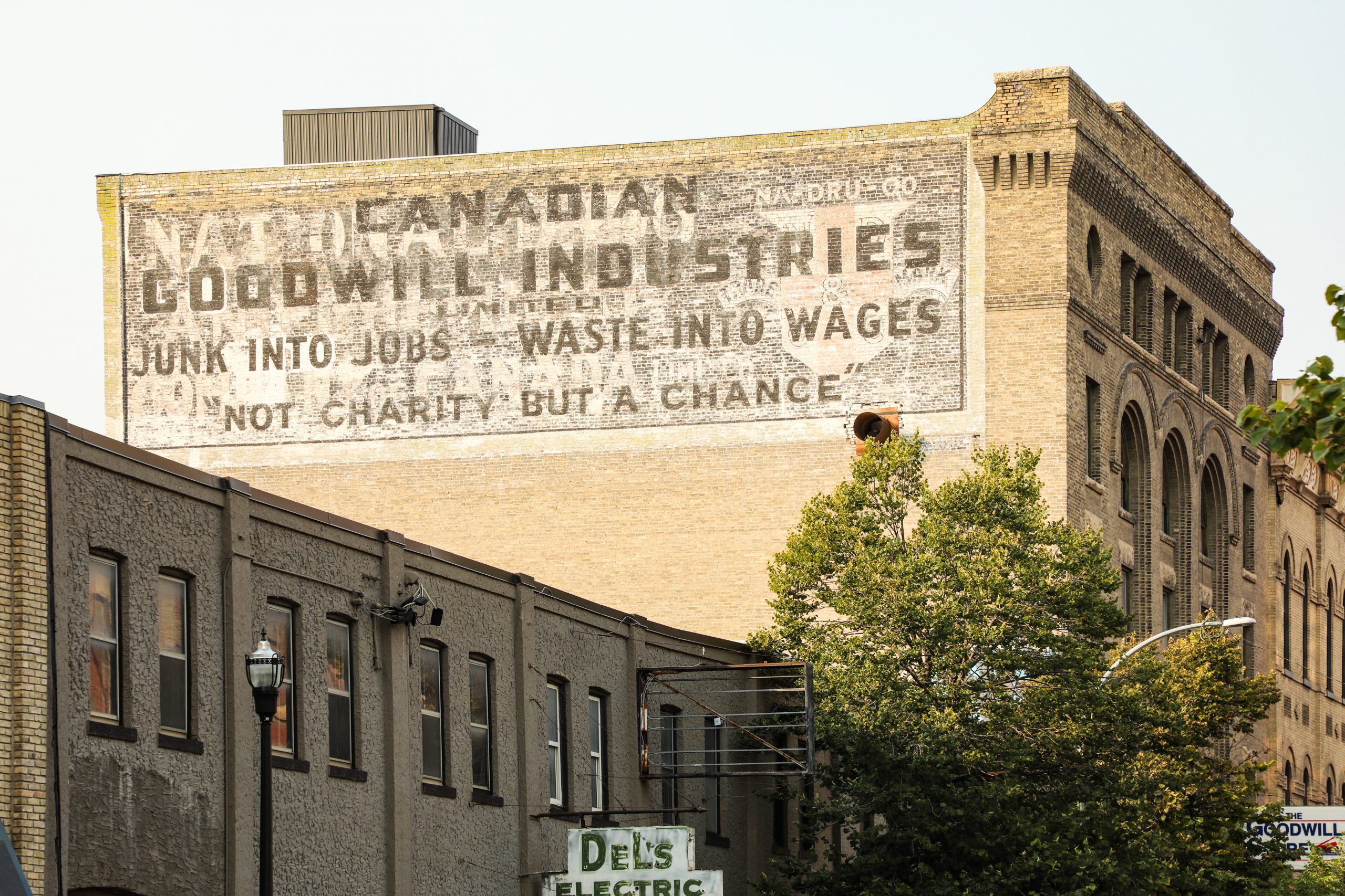 Close-up image of Ghost Sign at 70 Princess advertising Canadian Goodwill Industries