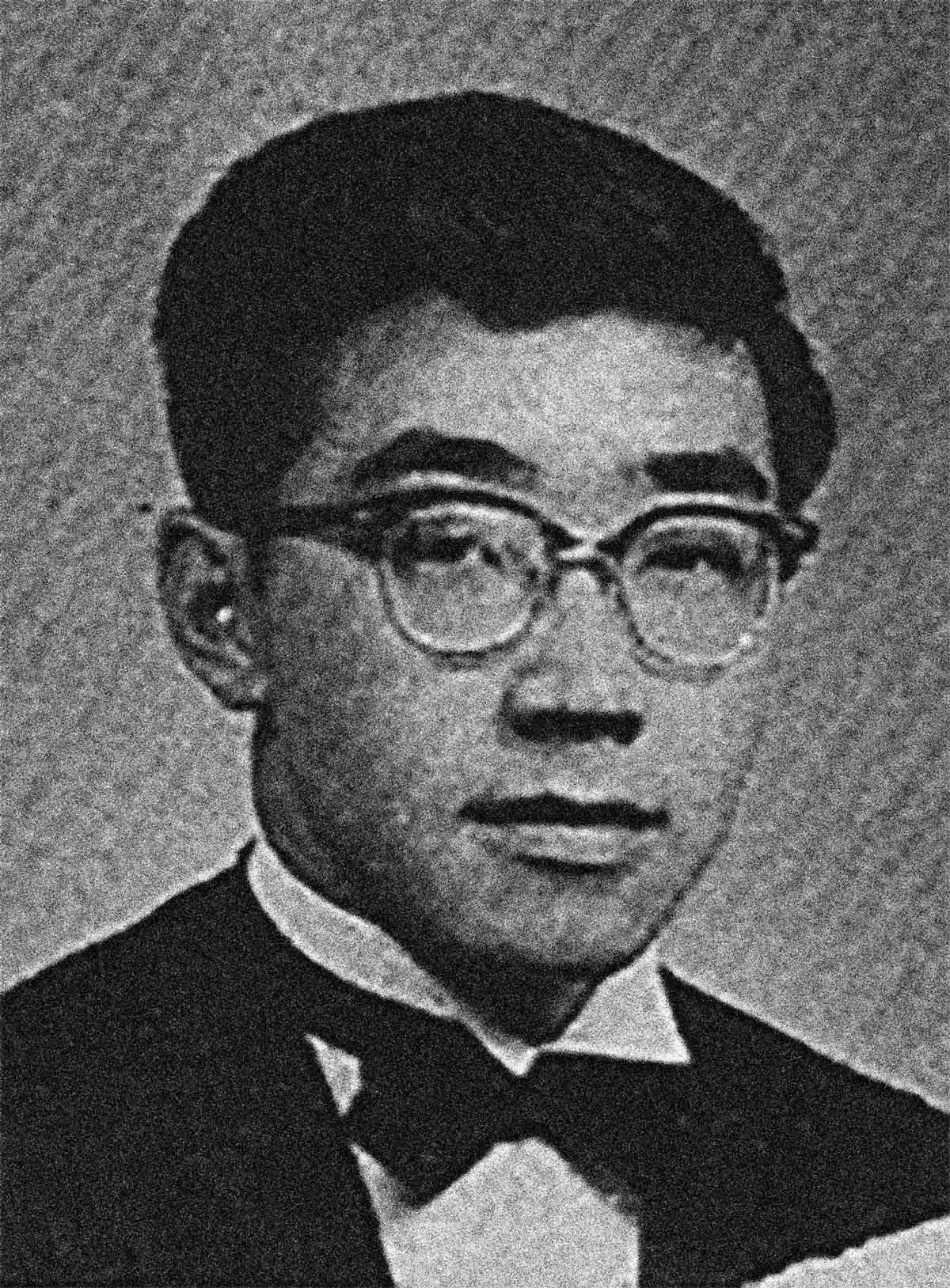 Image shows a young man wearing a bowtie and glasses.