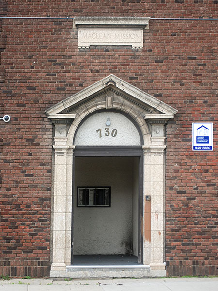 The doorway of 730 Alexander Avenue. There is a stone arch above the door, with "730" engraved into it.